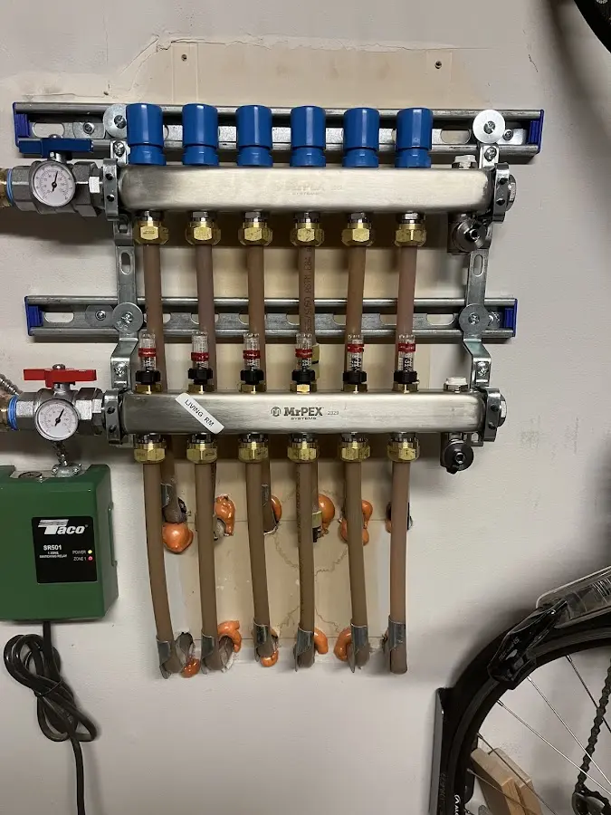 Plumber performing Water Heater Repair at a residential property in Algood